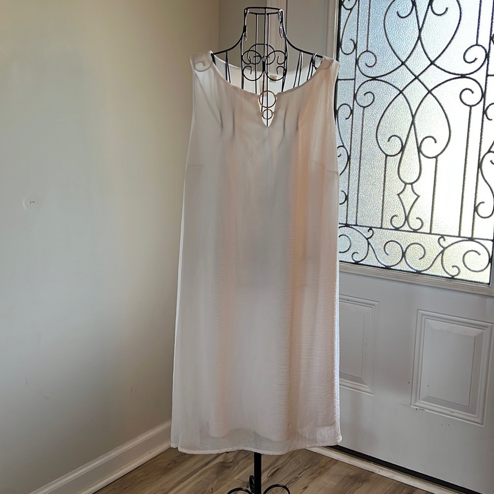 Tacera white dress with metal details.